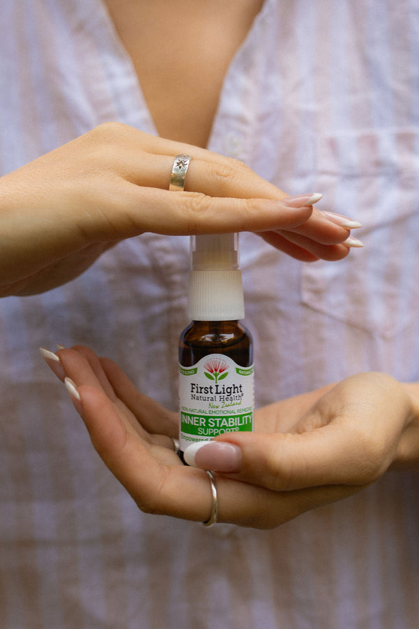 Inner Stability Support oral spray cupped between two hands