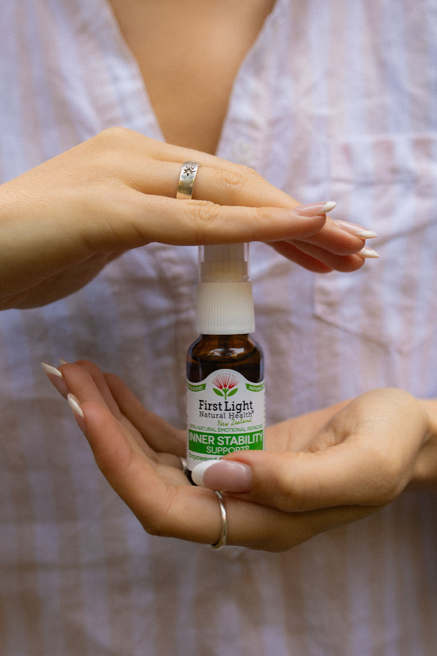 Inner Stability Support oral spray cupped between two hands