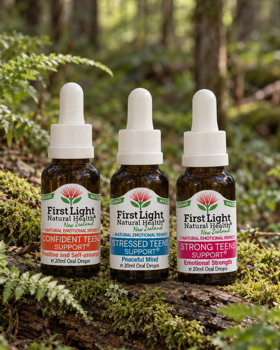 Confident Teens Support, Stressed Teens Support and Strong Teens Support oral drops on a mossy log in native New Zealand forest