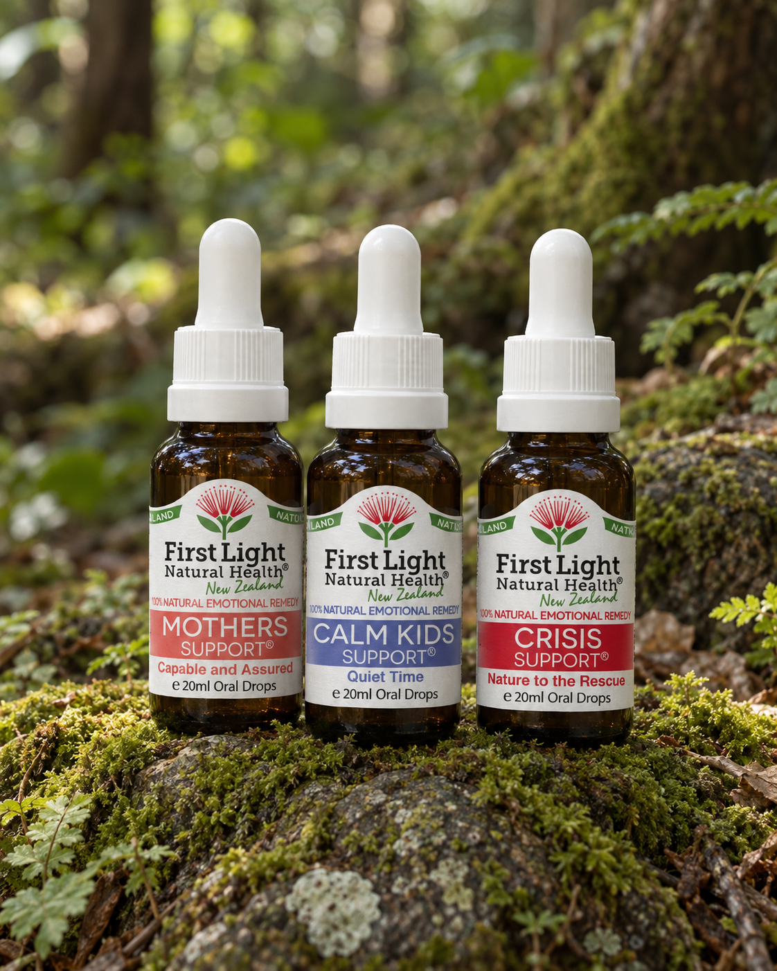 Mothers Support, Calm Kids Support and Crisis Support oral drops on a mossy rock in native New Zealand forest