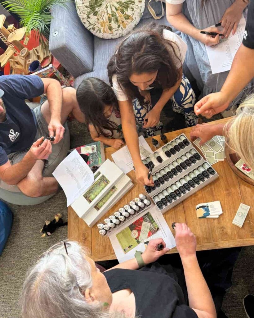 Mums, kids, dads and grandparents making up First Light® flower essence blends at a community centre.